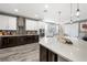 Spacious kitchen with island, stainless steel appliances, and two-tone cabinetry at 2365 Boretto St, Henderson, NV 89044