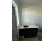 Bathroom with black vanity at 380 Erin St, Pahrump, NV 89048