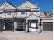 Exterior view of homes under construction featuring stucco and new roofing tiles at 380 Erin St, Pahrump, NV 89048