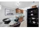 Modern kitchen with wooden cabinets, granite counters, and pantry at 4200 S Valley View Blvd # 1083, Las Vegas, NV 89103