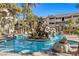 Resort-style pool with waterfall feature and lush landscaping at 4200 S Valley View Blvd # 1083, Las Vegas, NV 89103