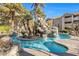 Inviting community pool with a waterfall feature and landscaping at 4200 S Valley View Blvd # 1083, Las Vegas, NV 89103