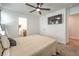 Spacious bedroom with large TV, ceiling fan, and ensuite bathroom access at 4278 Lemay St # 2, Las Vegas, NV 89115