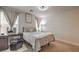 Bright bedroom with a queen bed and vanity area at 4278 Lemay St # 2, Las Vegas, NV 89115