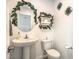 Stylish powder room with pedestal sink and decorative accents at 4278 Lemay St # 2, Las Vegas, NV 89115