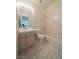 Full bathroom with a bathtub and single vanity at 4654 Stuttgart St, Las Vegas, NV 89147