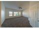 Bright bedroom featuring a ceiling fan and large windows at 4654 Stuttgart St, Las Vegas, NV 89147