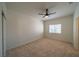 Spacious bedroom featuring a ceiling fan and large window at 4654 Stuttgart St, Las Vegas, NV 89147