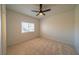 Bright bedroom with ceiling fan and neutral carpeting at 4654 Stuttgart St, Las Vegas, NV 89147