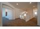 Upstairs hallway with carpet, access to bedrooms, and a staircase at 4654 Stuttgart St, Las Vegas, NV 89147