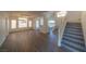 Two-story living room with hardwood floors and staircase at 4654 Stuttgart St, Las Vegas, NV 89147