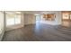 Open living area with hardwood floors, high ceilings, and kitchen view at 4654 Stuttgart St, Las Vegas, NV 89147