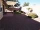 Covered patio, artificial turf, and gravel landscaping at 4694 E Lucera Ct, Pahrump, NV 89061