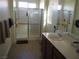 Bathroom with walk-in shower and double vanity at 4694 E Lucera Ct, Pahrump, NV 89061