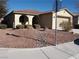 Single-story home with landscaped yard and attached garage at 4694 E Lucera Ct, Pahrump, NV 89061