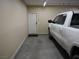 Garage with an additional door providing convenient interior access at 4694 E Lucera Ct, Pahrump, NV 89061