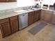 Kitchen with stainless steel dishwasher and granite countertops at 4694 E Lucera Ct, Pahrump, NV 89061