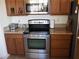 Kitchen featuring stainless steel appliances, including a range and microwave at 4694 E Lucera Ct, Pahrump, NV 89061