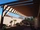 Covered patio with pergola and desert landscaping at 4694 E Lucera Ct, Pahrump, NV 89061