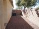 Side yard with gravel and block wall at 4694 E Lucera Ct, Pahrump, NV 89061