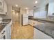 Kitchen with white cabinets, granite countertops, and gas stove at 4823 Jubilee Diamond Ct, Las Vegas, NV 89139