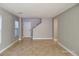 Spacious living room featuring light gray walls and tile floors at 4823 Jubilee Diamond Ct, Las Vegas, NV 89139