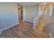 Upstairs hallway with light walls and wood-look floors at 4823 Jubilee Diamond Ct, Las Vegas, NV 89139