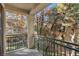 Private balcony overlooking a tree-filled courtyard at 5155 W Tropicana Ave # 2123, Las Vegas, NV 89103