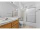 Bright bathroom featuring a tub shower combo and wood vanity at 5155 W Tropicana Ave # 2123, Las Vegas, NV 89103