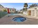 Community pool and spa with surrounding patio and seating at 5155 W Tropicana Ave # 2123, Las Vegas, NV 89103