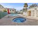 Community pool and spa with surrounding patio at 5155 W Tropicana Ave # 2123, Las Vegas, NV 89103