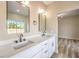 Double vanity bathroom with quartz countertop and matte black fixtures at 5306 Falling Petals Dr, North Las Vegas, NV 89031