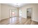 Bedroom with wood-look floors, access to closets and ensuite bathroom at 5306 Falling Petals Dr, North Las Vegas, NV 89031