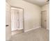 Spacious bedroom with doors to hallway and another room at 5306 Falling Petals Dr, North Las Vegas, NV 89031