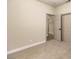 Well-lit bedroom featuring carpet and an additional door at 5306 Falling Petals Dr, North Las Vegas, NV 89031