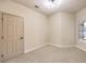 Well-lit bedroom featuring a window and closet at 5306 Falling Petals Dr, North Las Vegas, NV 89031