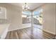 Bright dining area with hardwood floors and sliding glass doors to the backyard at 5306 Falling Petals Dr, North Las Vegas, NV 89031