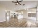 Modern kitchen with island and open concept to living area at 5306 Falling Petals Dr, North Las Vegas, NV 89031