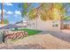 Backyard with artificial turf, gravel, and comfortable seating area at 5420 Doe Ave, Las Vegas, NV 89146