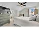 Serene bedroom with a dresser, seating area, and ceiling fan at 5420 Doe Ave, Las Vegas, NV 89146