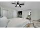 Spacious bedroom with a large bed, ceiling fan, and TV at 5420 Doe Ave, Las Vegas, NV 89146