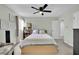 Cozy bedroom featuring a ceiling fan and window at 5420 Doe Ave, Las Vegas, NV 89146