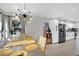 Bright dining area with a modern chandelier and spacious table at 5420 Doe Ave, Las Vegas, NV 89146