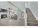 Living room with fireplace and view into the kitchen and upstairs at 5420 Doe Ave, Las Vegas, NV 89146