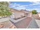 Front view of a house with a gravel pathway and desert landscaping at 5533 Ramirez St, North Las Vegas, NV 89031