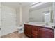 Bathroom features a tub/shower, vanity with sink, and neutral tile floors at 5636 Granville Lake St, North Las Vegas, NV 89031