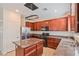 Modern kitchen featuring an island, stainless steel appliances, and ample counter space at 5636 Granville Lake St, North Las Vegas, NV 89031