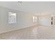 Spacious living room featuring tile floors and ample natural light from multiple windows at 5636 Granville Lake St, North Las Vegas, NV 89031