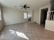 Spacious living room featuring a cozy fireplace and tile floors for easy maintenance at 5636 Granville Lake St, North Las Vegas, NV 89031