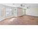 Expansive main bedroom with large windows, plush carpet, and dual ceiling fans at 5636 Granville Lake St, North Las Vegas, NV 89031